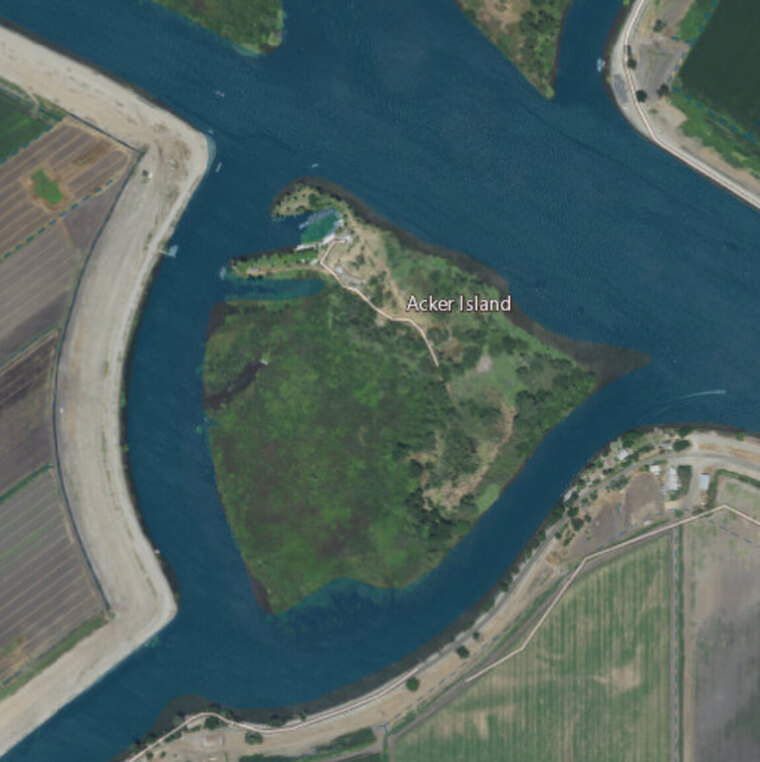 An aerial image of an island coastline, the source
