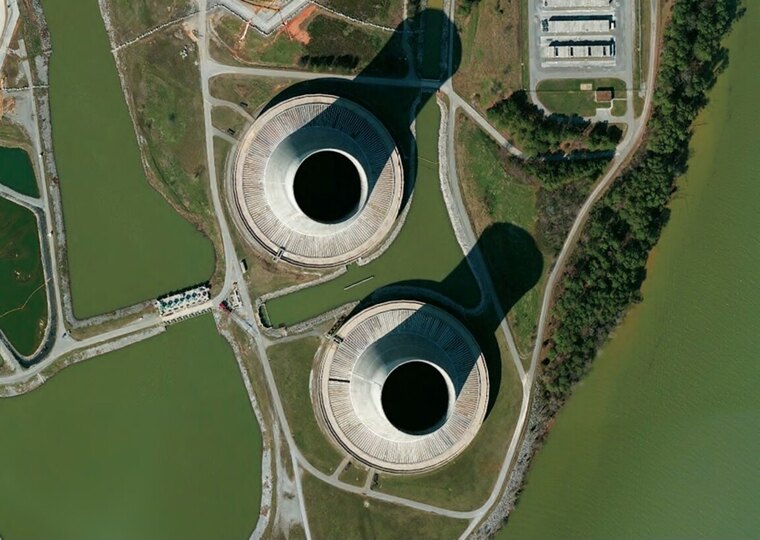 A photograph of nuclear cooling towers, the source